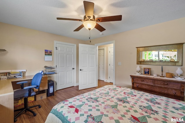 3608 Glengevlin Way, Bettendorf, IA 52722 - bedroom featuring wood finished floors, a desk, and a ceiling fan