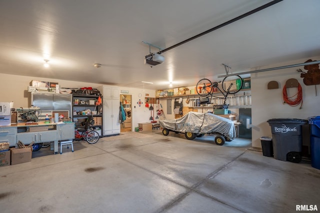 3608 Glengevlin Way, Bettendorf, IA 52722 - garage with a garage door opener and a workshop area