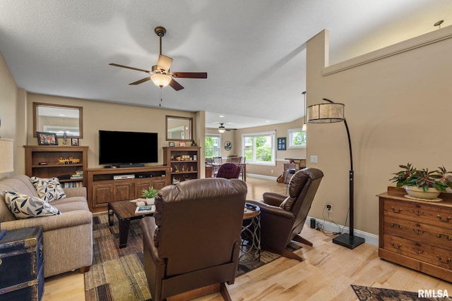 3608 Glengevlin Way, Bettendorf, IA 52722 - living area featuring ceiling fan, light wood-type flooring, and baseboards