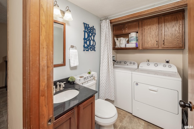 1425 W 48th St, Davenport, IA 52806 - bathroom with washing machine and dryer, toilet, and vanity