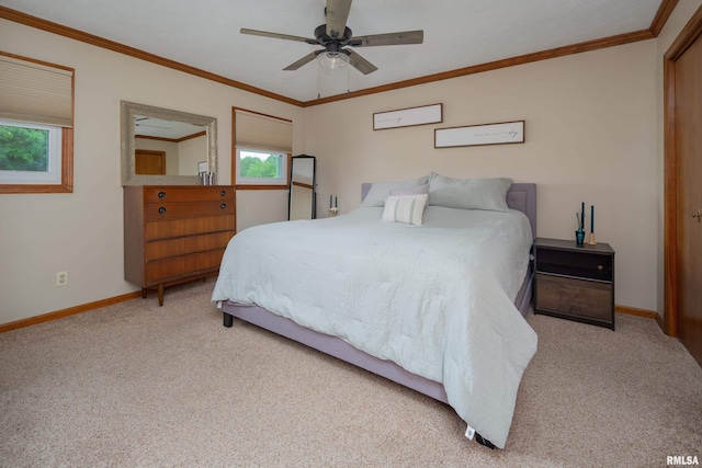 1425 W 48th St, Davenport, IA 52806 - bedroom featuring carpet floors, baseboards, ornamental molding, and a ceiling fan