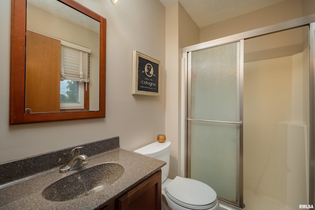 1425 W 48th St, Davenport, IA 52806 - full bath featuring a stall shower, toilet, vanity, and a textured ceiling
