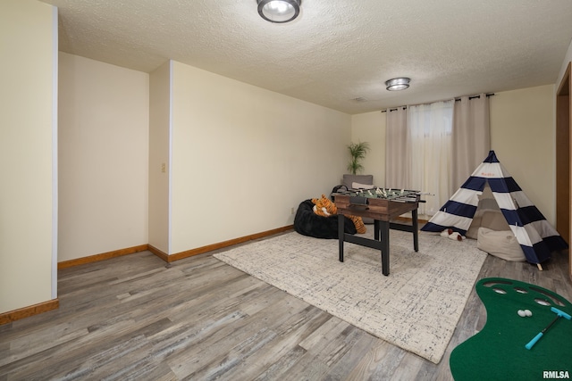 1425 W 48th St, Davenport, IA 52806 - dining space featuring wood finished floors, baseboards, and a textured ceiling