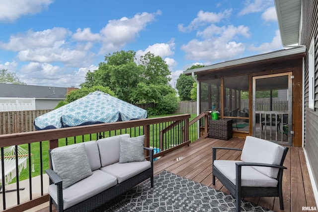 1425 W 48th St, Davenport, IA 52806 - wooden terrace with a sunroom, an outdoor hangout area, and a fenced backyard
