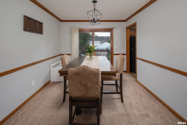 1425 W 48th St, Davenport, IA 52806 - dining space with a chandelier, light carpet, a textured ceiling, ornamental molding, and baseboards