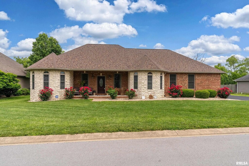 1701 Dew Drop Dr, Marion, IL 62959 - ranch-style house with stone siding, a porch, and a front yard