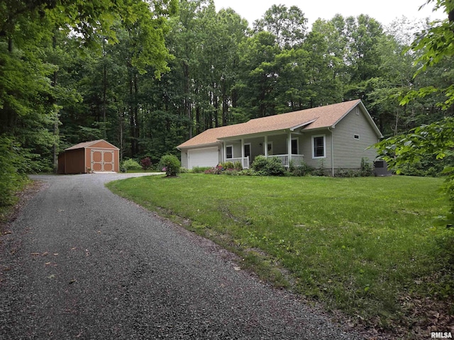 179 Hazel Rd, Simpson, IL 62985 - ranch-style home featuring a porch, a front yard, a garage, driveway, and a forest view