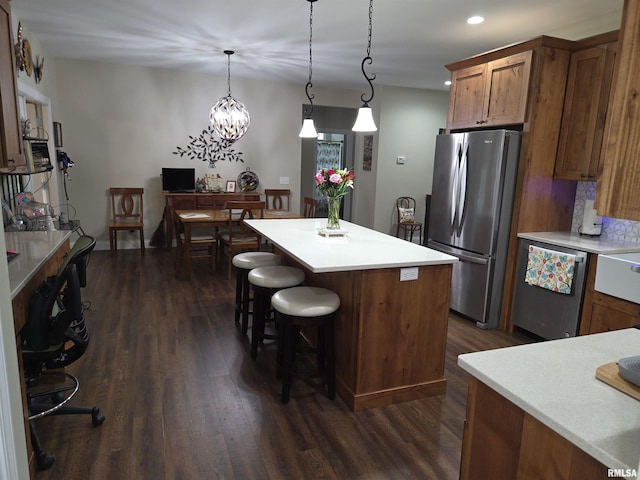 179 Hazel Rd, Simpson, IL 62985 - kitchen with appliances with stainless steel finishes, dark wood-style flooring, a kitchen island, light countertops, and recessed lighting