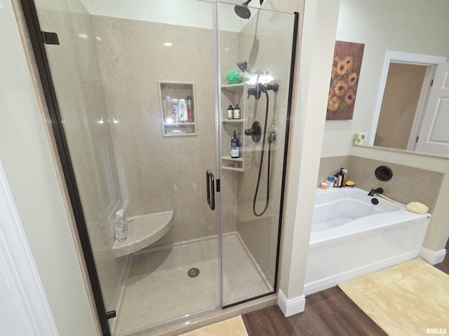 179 Hazel Rd, Simpson, IL 62985 - full bath with a garden tub, a shower stall, and wood finished floors