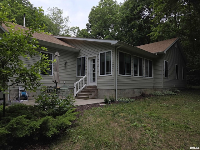 179 Hazel Rd, Simpson, IL 62985 - view of front of home featuring entry steps, a shingled roof, a front lawn, and a patio