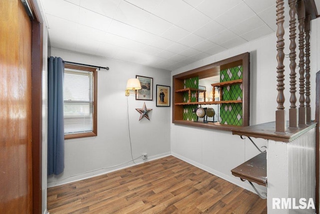 1240 Spruce St, Buffalo, IA 52728 - unfurnished room featuring wood finished floors and baseboards