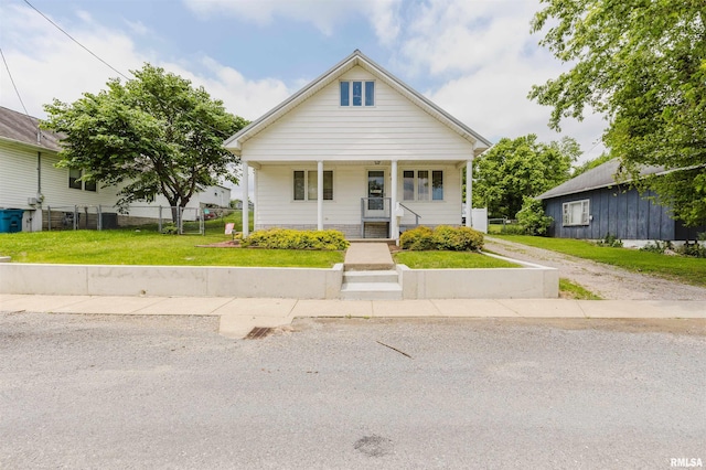 1408 Newton Ave, Johnston City, IL 62951 - bungalow featuring a porch