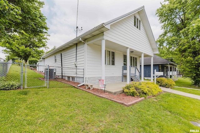 1408 Newton Ave, Johnston City, IL 62951 - view of front of home with a gate and a porch