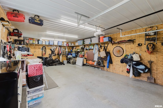 1408 Newton Ave, Johnston City, IL 62951 - garage featuring a garage door opener and a workshop area