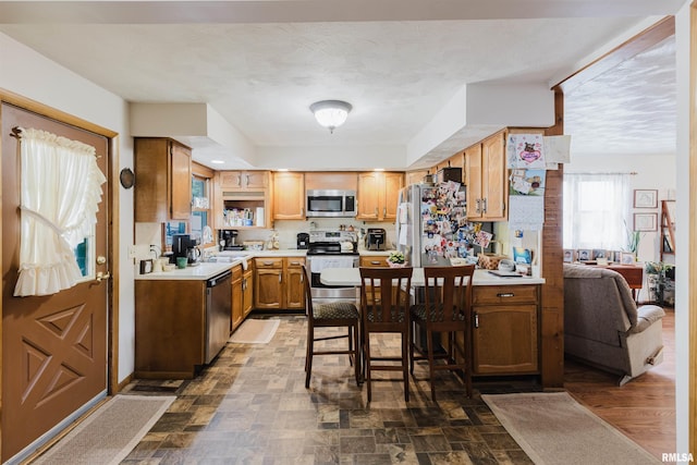 1408 Newton Ave, Johnston City, IL 62951 - kitchen featuring appliances with stainless steel finishes, light countertops, and dark stone finish flooring