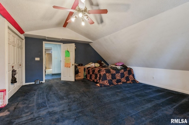 201 4th St, New Boston, IL 61272 - carpeted bedroom featuring vaulted ceiling, baseboards, ceiling fan, and a textured ceiling