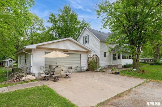 201 4th St, New Boston, IL 61272 - back of property featuring a patio