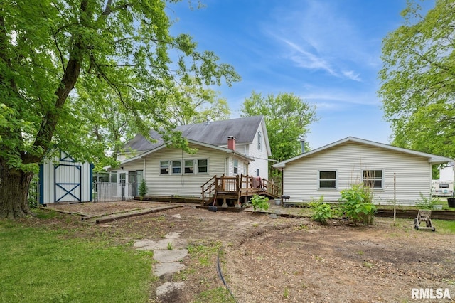 201 4th St, New Boston, IL 61272 - rear view of house with a wooden deck