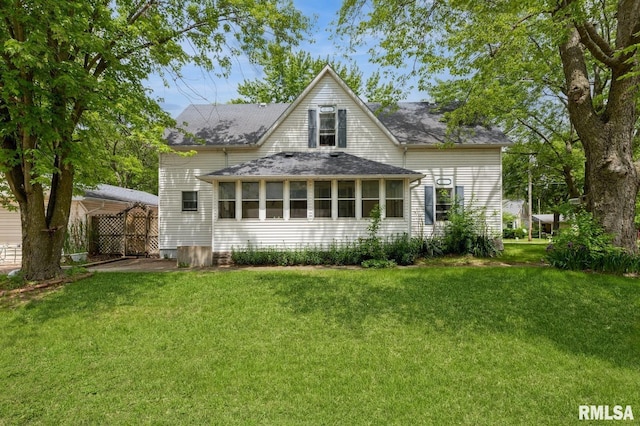 201 4th St, New Boston, IL 61272 - rear view of property with a yard and roof with shingles