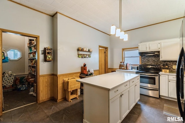 201 4th St, New Boston, IL 61272 - kitchen with stainless steel electric stove, wainscoting, ornamental molding, under cabinet range hood, and white cabinets