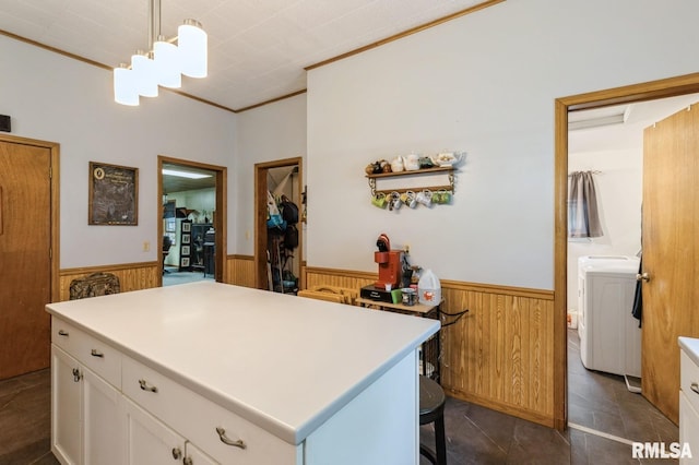 201 4th St, New Boston, IL 61272 - kitchen featuring wainscoting, white cabinets, crown molding, wood walls, and light countertops