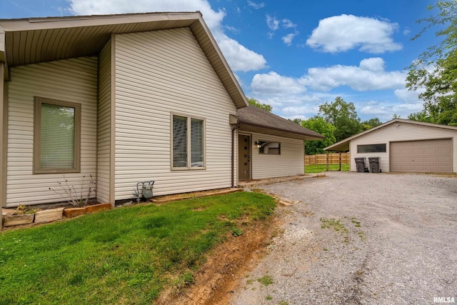 611 E Grand Ave, Carterville, IL 62918 - view of home's exterior with a detached garage and an outdoor structure