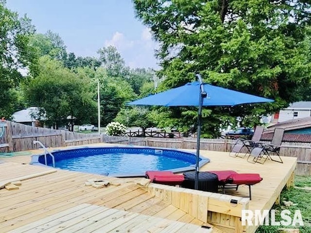 611 E Grand Ave, Carterville, IL 62918 - view of swimming pool with a deck and a fenced backyard