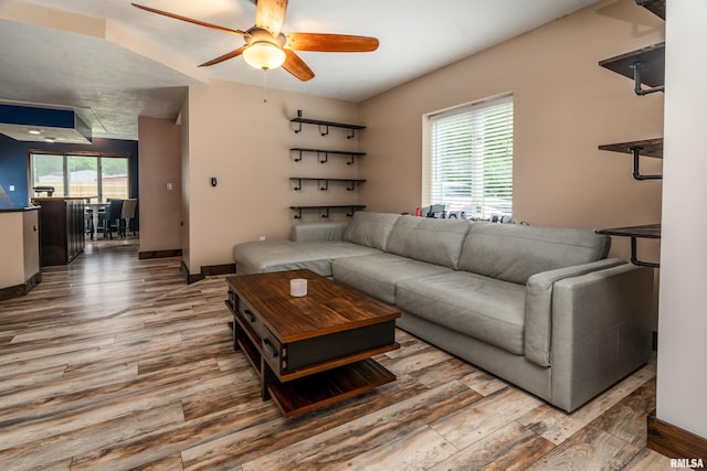 611 E Grand Ave, Carterville, IL 62918 - living room featuring wood finished floors, a ceiling fan, and baseboards