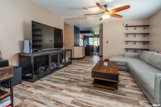 611 E Grand Ave, Carterville, IL 62918 - living room featuring ceiling fan, wood finished floors, and baseboards