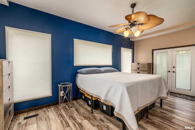 611 E Grand Ave, Carterville, IL 62918 - bedroom featuring wood finished floors, french doors, and ceiling fan