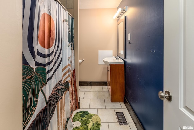 611 E Grand Ave, Carterville, IL 62918 - bathroom featuring vanity, tile patterned floors, and a shower with curtain