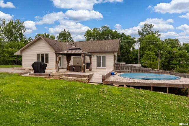 611 E Grand Ave, Carterville, IL 62918 - back of property with a gazebo, a lawn, a wooden deck, and roof with shingles