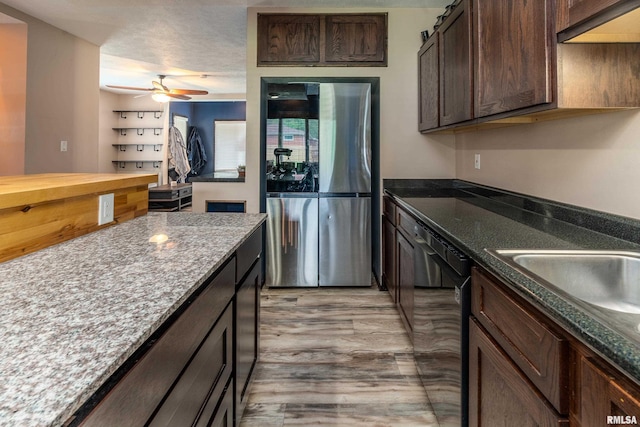 611 E Grand Ave, Carterville, IL 62918 - kitchen featuring freestanding refrigerator, dishwasher, dark brown cabinets, ceiling fan, and light wood-type flooring