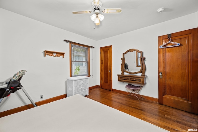519 2nd St, Camanche, IA 52730 - bedroom with wood finished floors, baseboards, and ceiling fan
