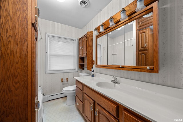 519 2nd St, Camanche, IA 52730 - bathroom with wallpapered walls, toilet, vanity, a baseboard radiator, and a shower