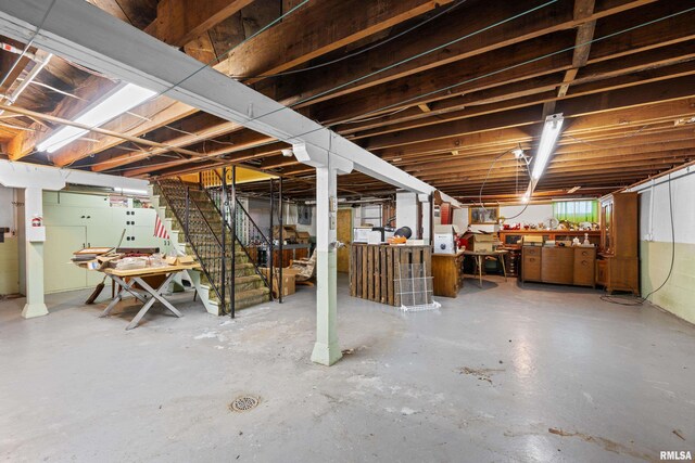 519 2nd St, Camanche, IA 52730 - below grade area featuring stairs and a workshop area