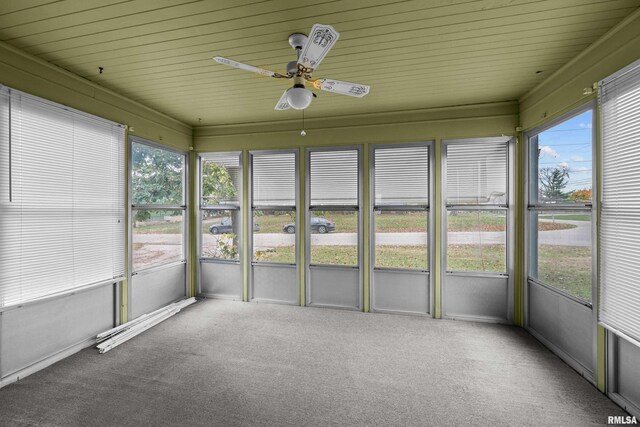 519 2nd St, Camanche, IA 52730 - unfurnished sunroom with a ceiling fan