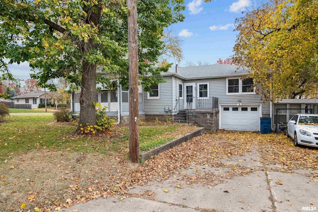 519 2nd St, Camanche, IA 52730 - view of front facade with an attached garage and driveway