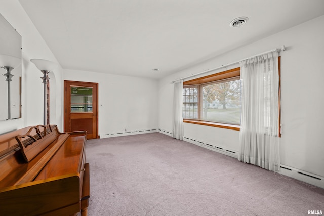 519 2nd St, Camanche, IA 52730 - unfurnished living room featuring carpet and a baseboard radiator