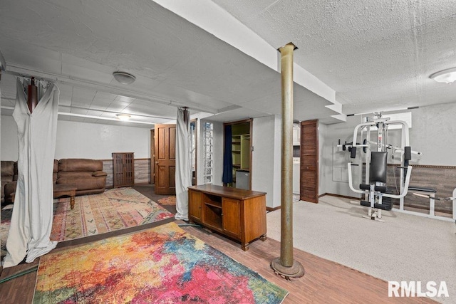 2446 16th Ave, Moline, IL 61265 - finished below grade area featuring wood finished floors and a textured ceiling