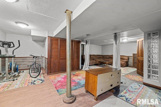 2446 16th Ave, Moline, IL 61265 - finished below grade area featuring wood finished floors and a textured ceiling