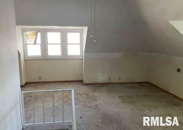 207 W Wilson St, New London, IA 52645 - additional living space featuring lofted ceiling