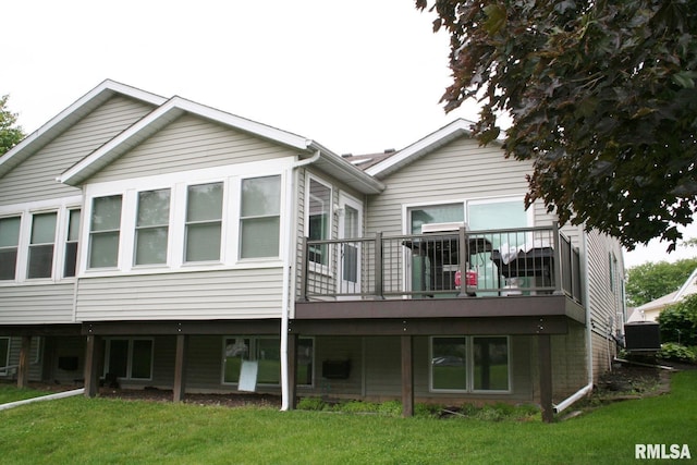 4011 Prairie Ln, Bettendorf, IA 52722 - rear view of house with a yard, central AC, and a wooden deck
