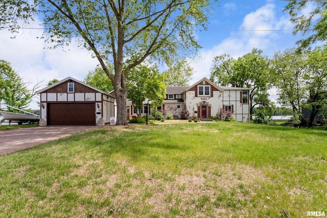 905 1st St, Camanche, IA 52730 - view of front of property featuring driveway, a front yard, and an attached garage
