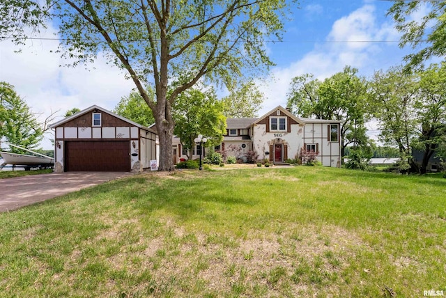 905 1st St, Camanche, IA 52730 - view of front of property with concrete driveway, a front lawn, and an attached garage