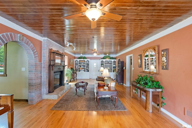 905 1st St, Camanche, IA 52730 - living area featuring a ceiling fan, baseboards, crown molding, hardwood / wood-style flooring, and wood ceiling
