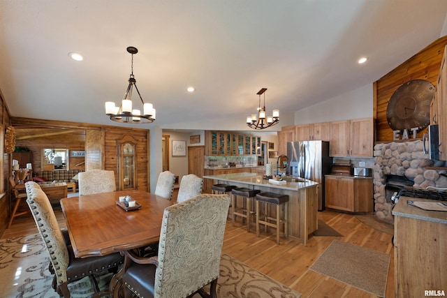 905 1st St, Camanche, IA 52730 - dining area featuring a chandelier, light wood-type flooring, vaulted ceiling, and recessed lighting