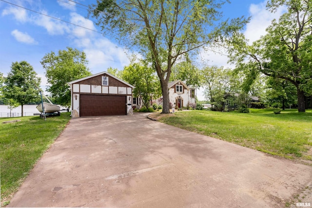 905 1st St, Camanche, IA 52730 - view of front facade with a garage, a front lawn, and concrete driveway