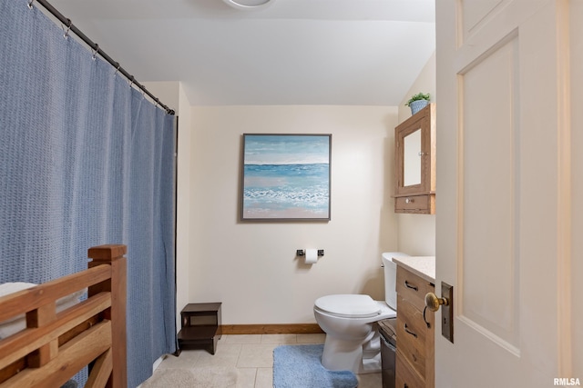 905 1st St, Camanche, IA 52730 - bathroom featuring toilet, tile patterned flooring, vanity, and baseboards