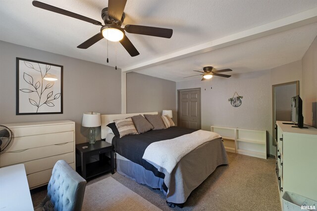 905 1st St, Camanche, IA 52730 - bedroom featuring light carpet, a ceiling fan, and beam ceiling